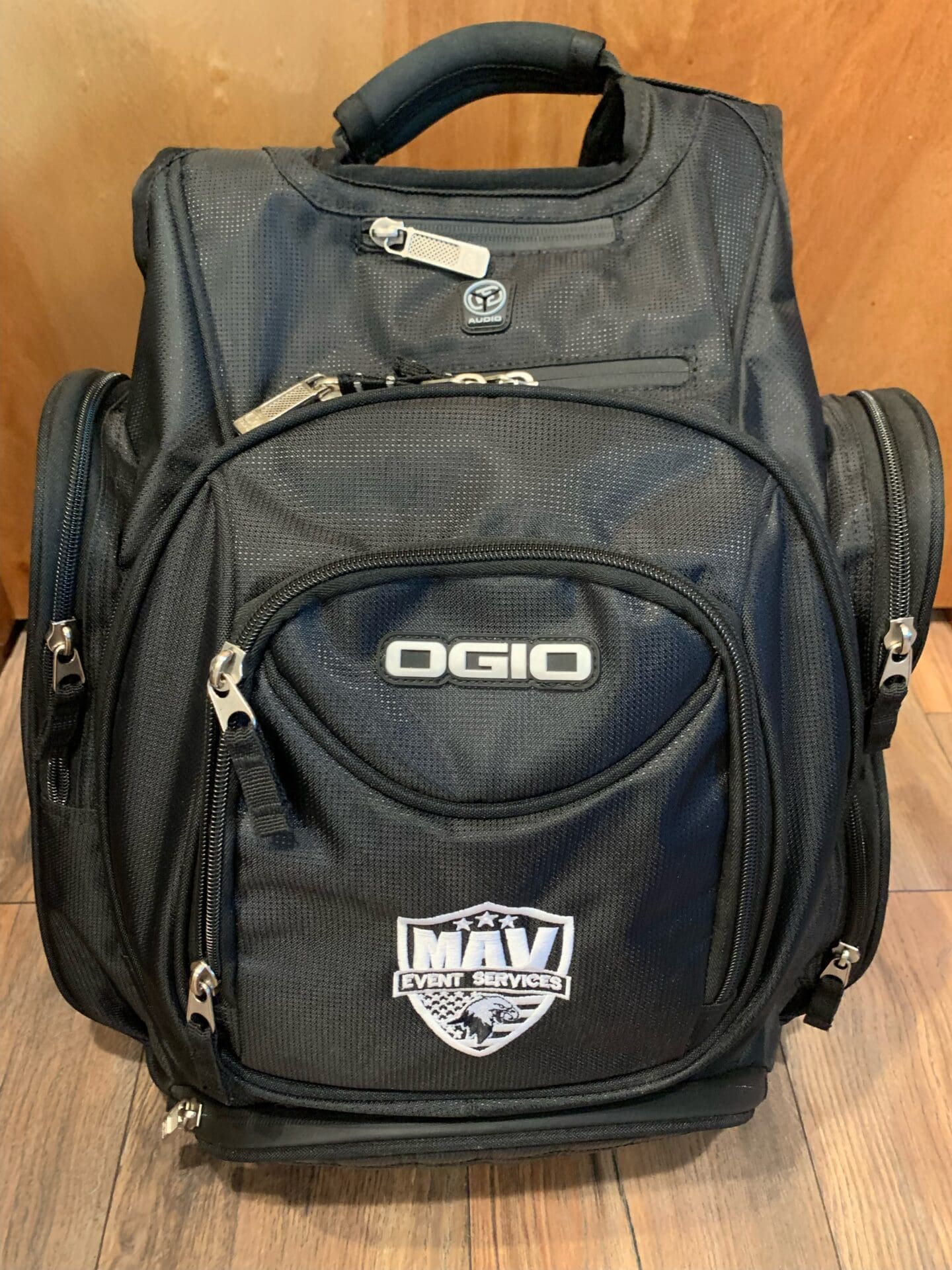 A black backpack with an ogio logo on it.