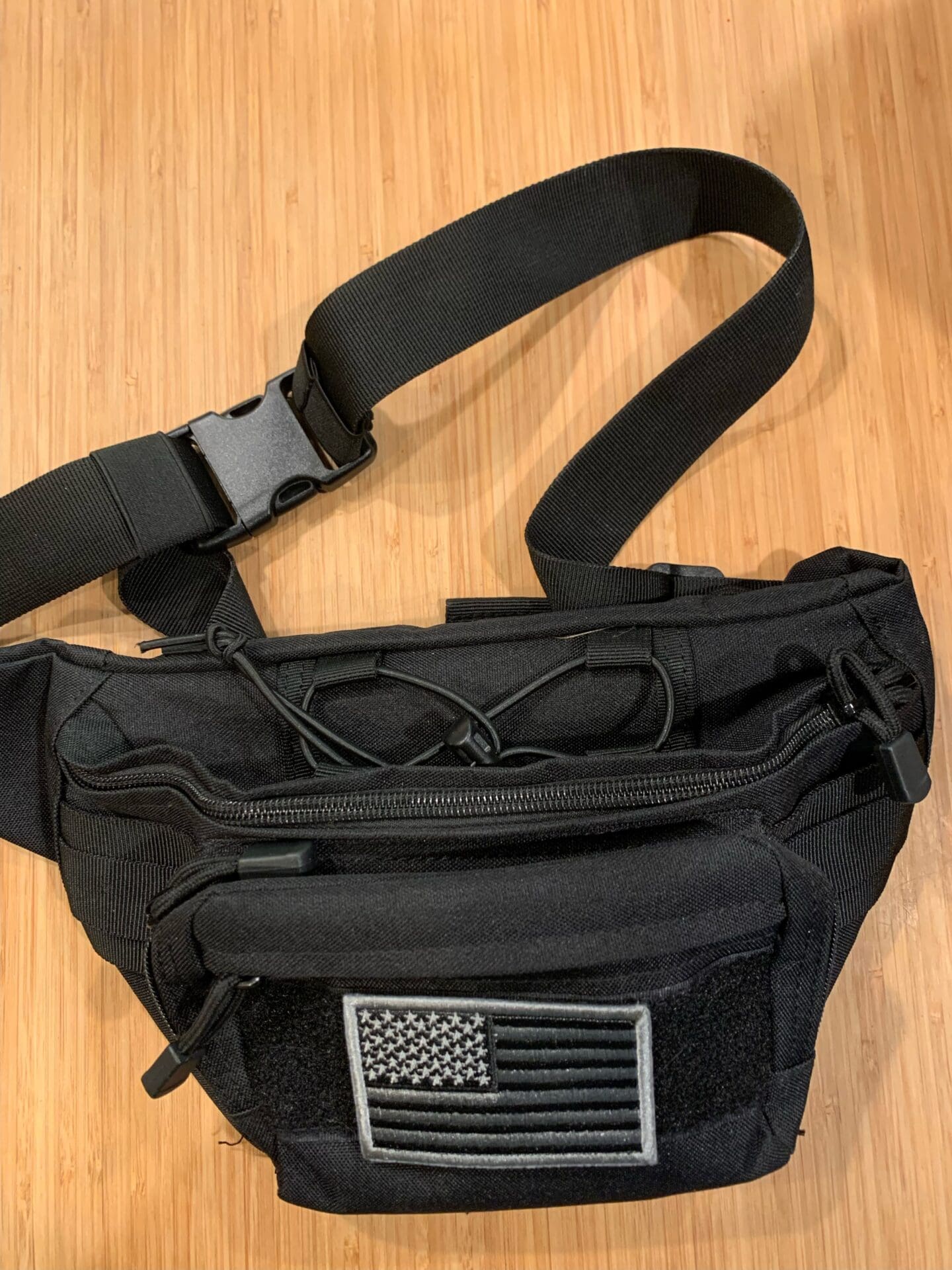 A black bag with an american flag on it.